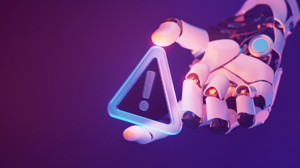 A stylized, digital-art image of a robotic hand extending its fingers to hold a glowing, translucent warning sign featuring an exclamation point, set against a dark purple and blue mixed gradient background