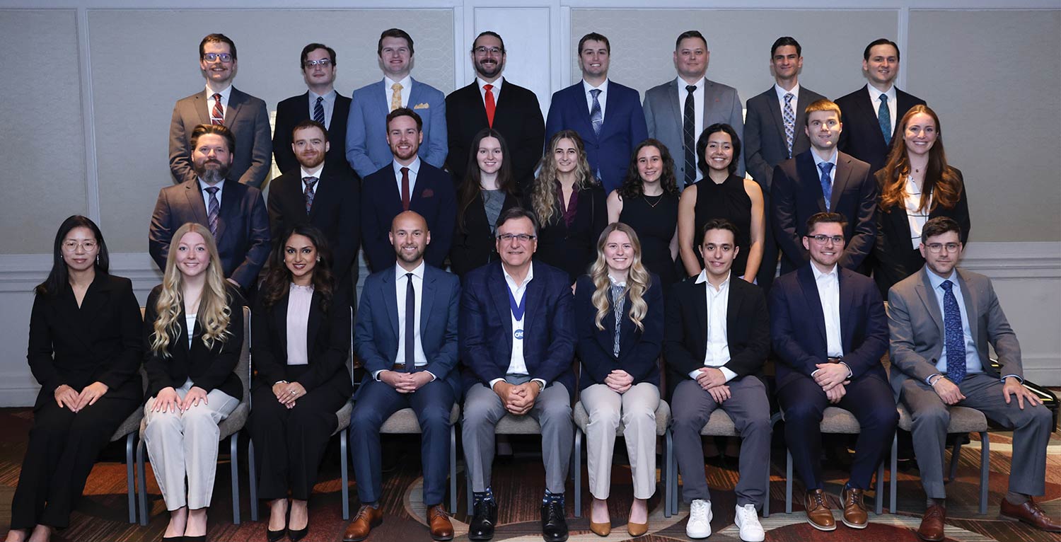 Group portrait of CAS associates and the CAS President posing together.