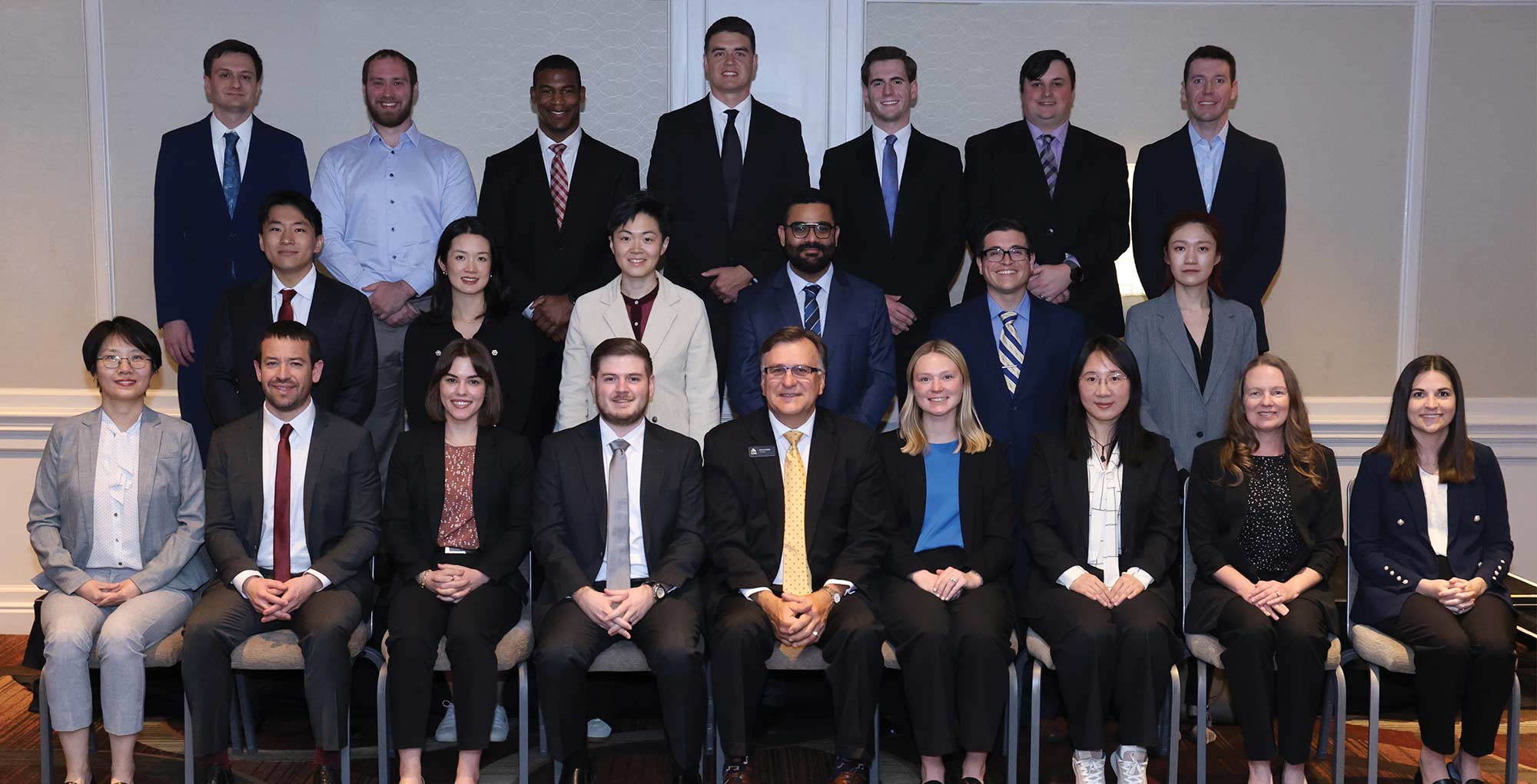 Group photo of new CAS fellows posing in three rows with the CAS President.