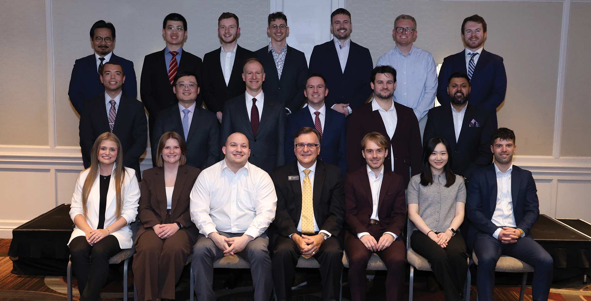 Group photo of new CAS fellows posing in three rows with the CAS President.